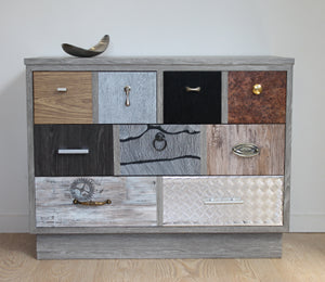 Vinyl covered lowboy with each drawer front in a different vinyl pattern