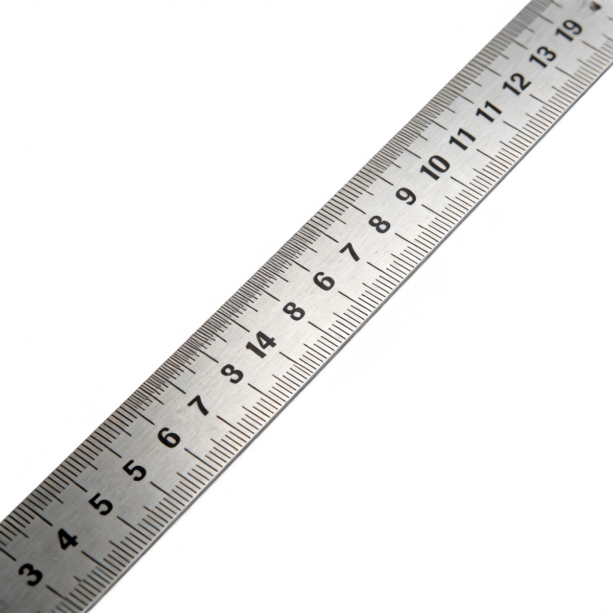 Metal ruler with measurement scale on a white background