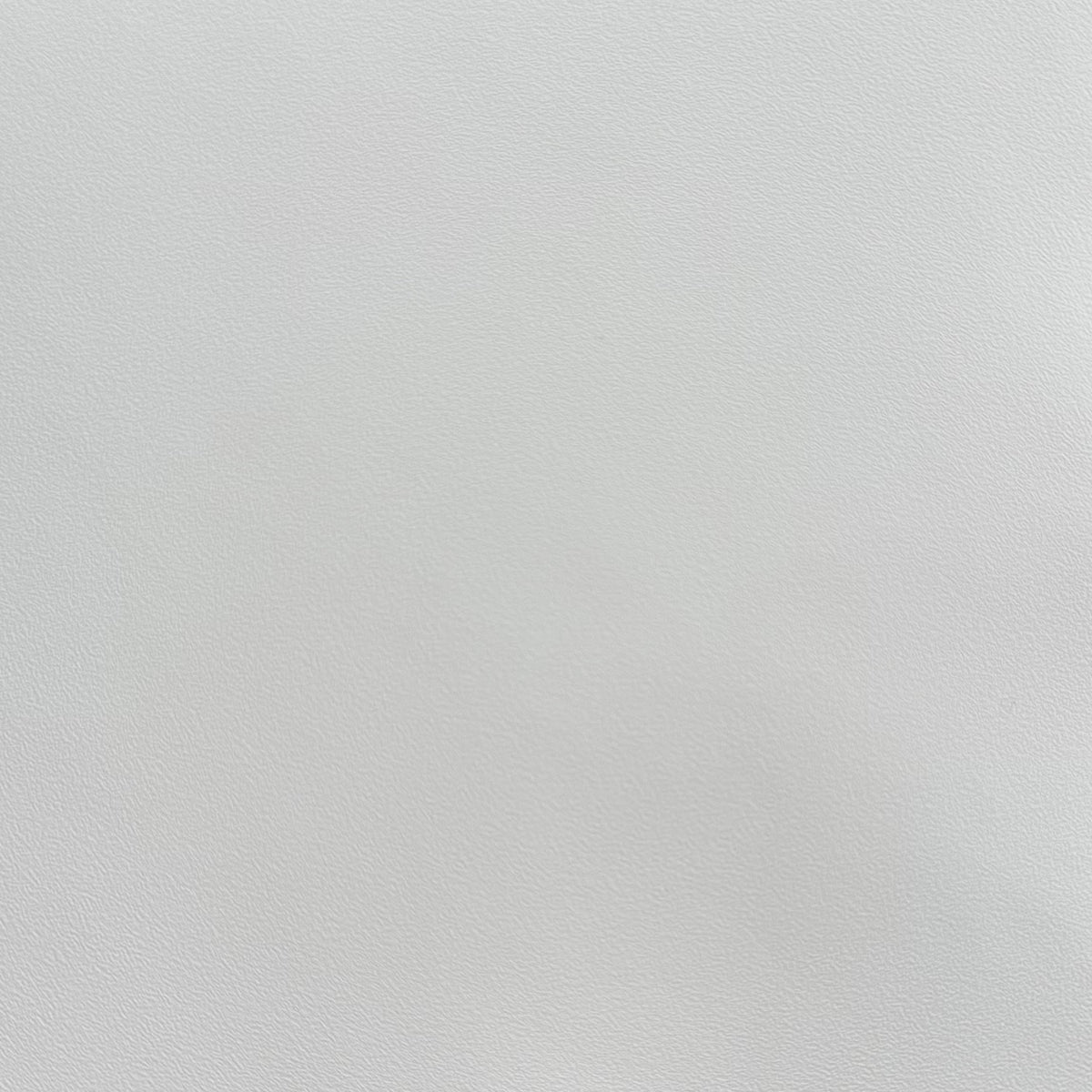 A close-up of an alabaster white textured adhesive vinyl.