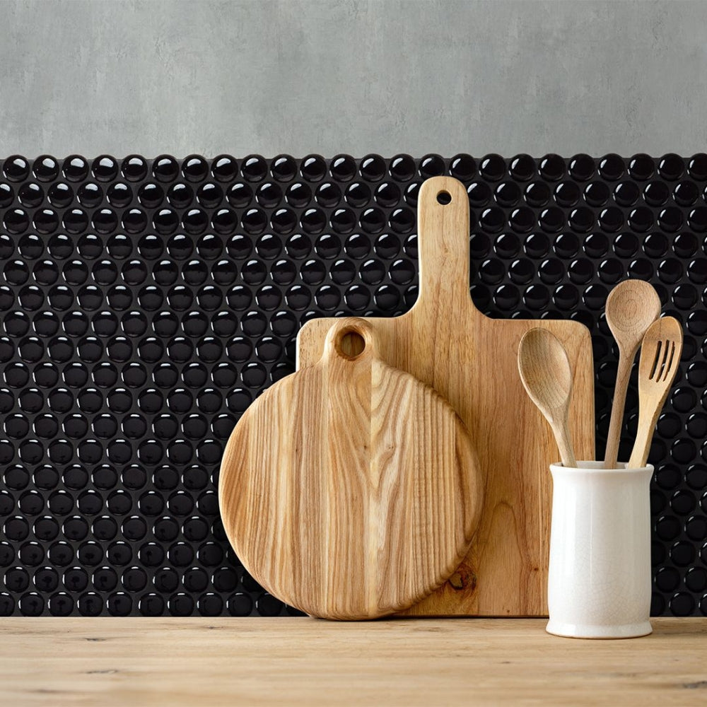 Black penny self-adhesive 3D tiles as a kitchen backsplash