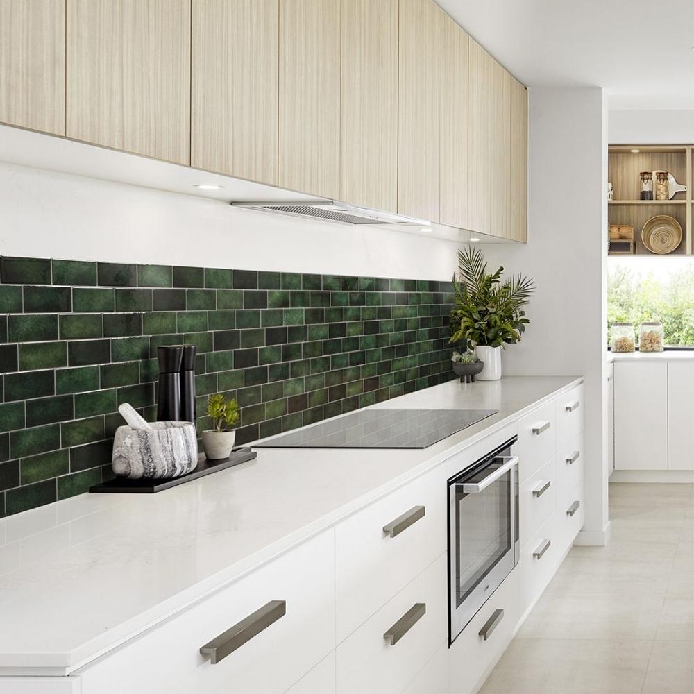 Green self-adhesive 3D subway tile in a kitchen