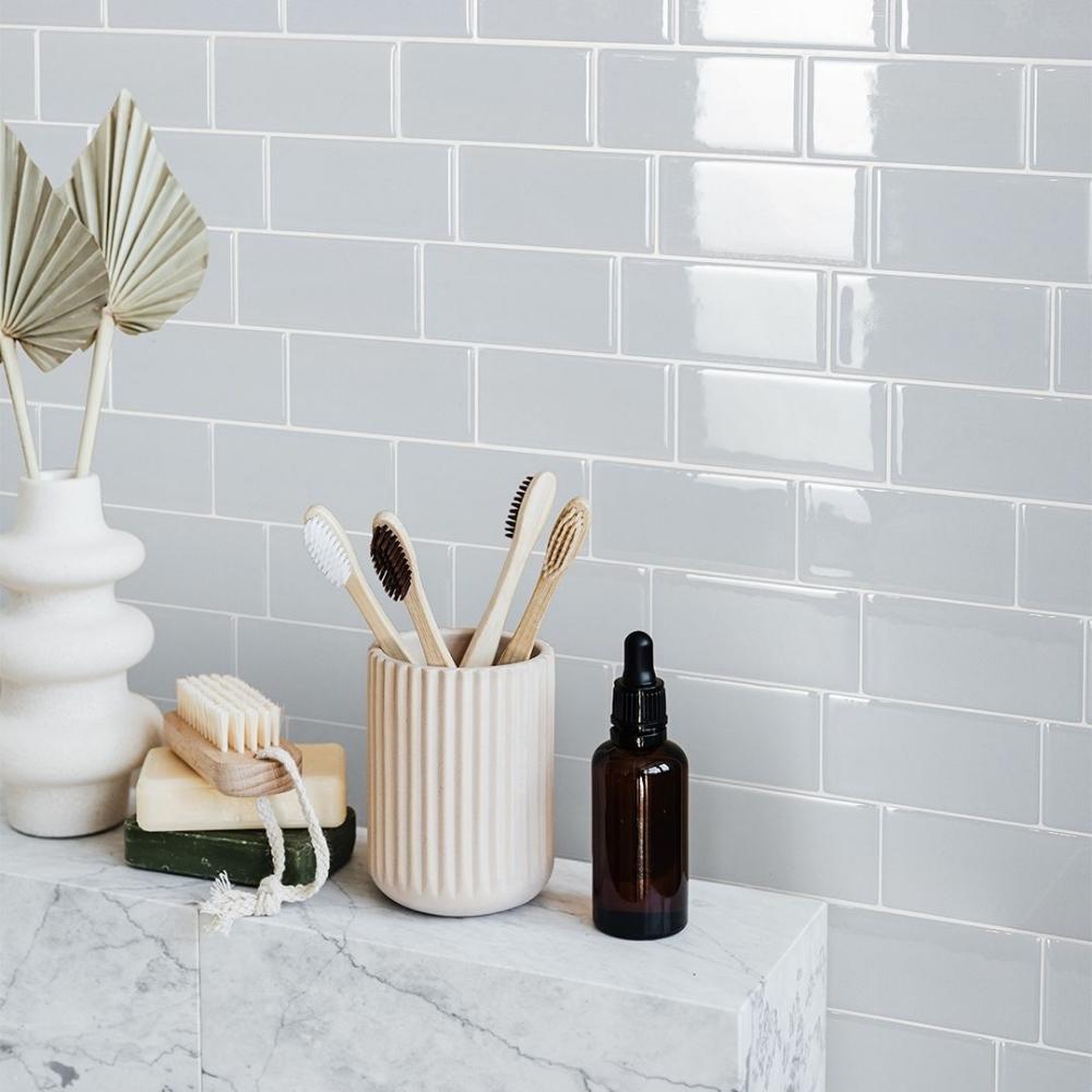 Grey green self-adhesive 3D subway tile in a bathroom