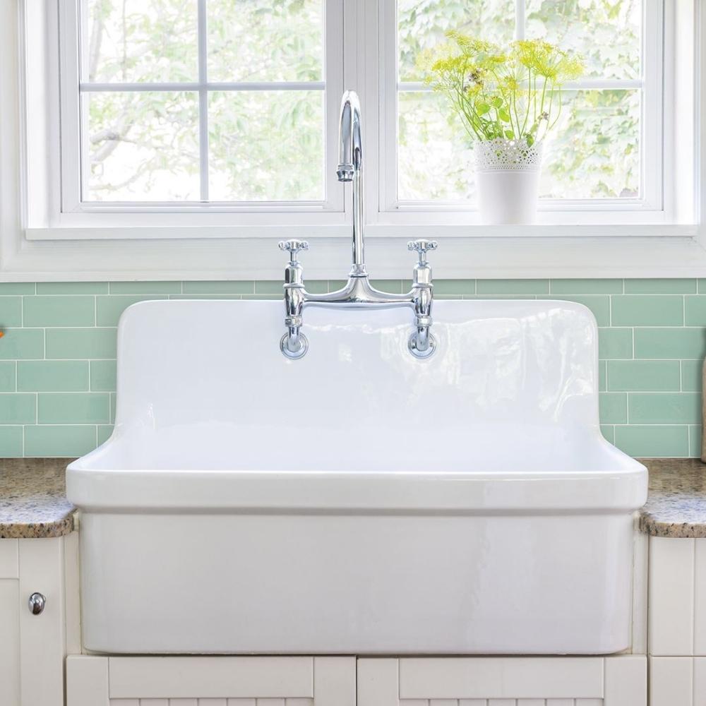 Mint green self-adhesive 3D subway tile in a kitchen