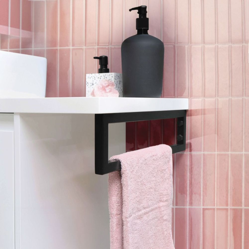 Pink stacked subway tile in bathroom