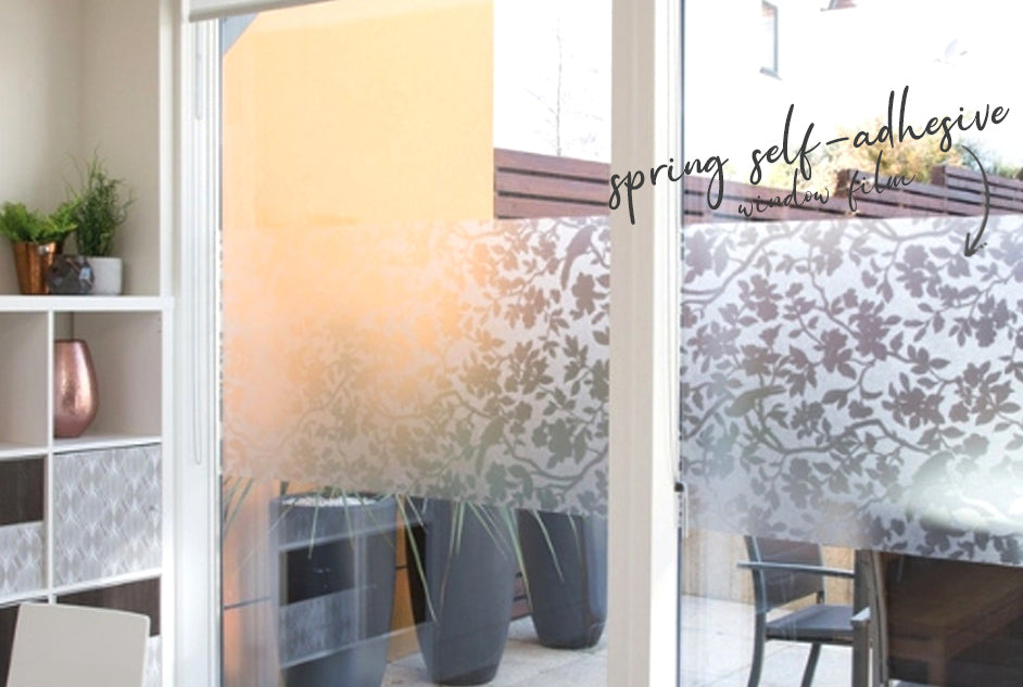 Self-adhesive window film in flower pattern on a ranch slider 