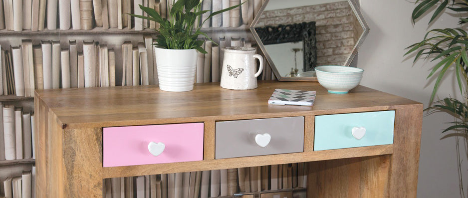 Desk with three drawers across covered in pink, grey and mint vinyl