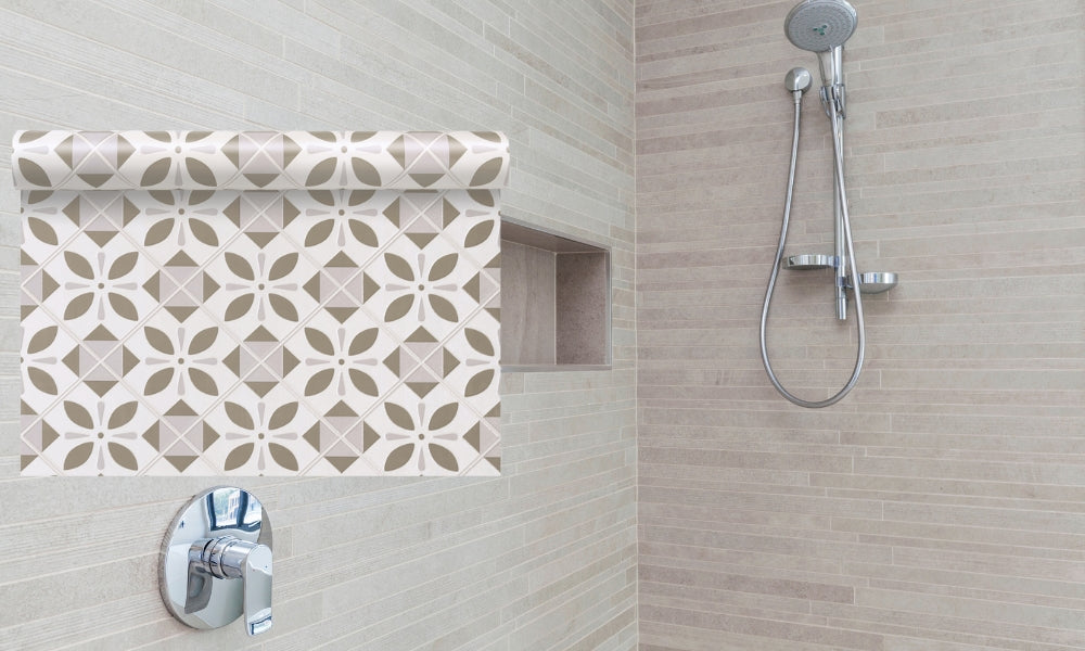 Bathroom shower area with tiled wall and shower head.