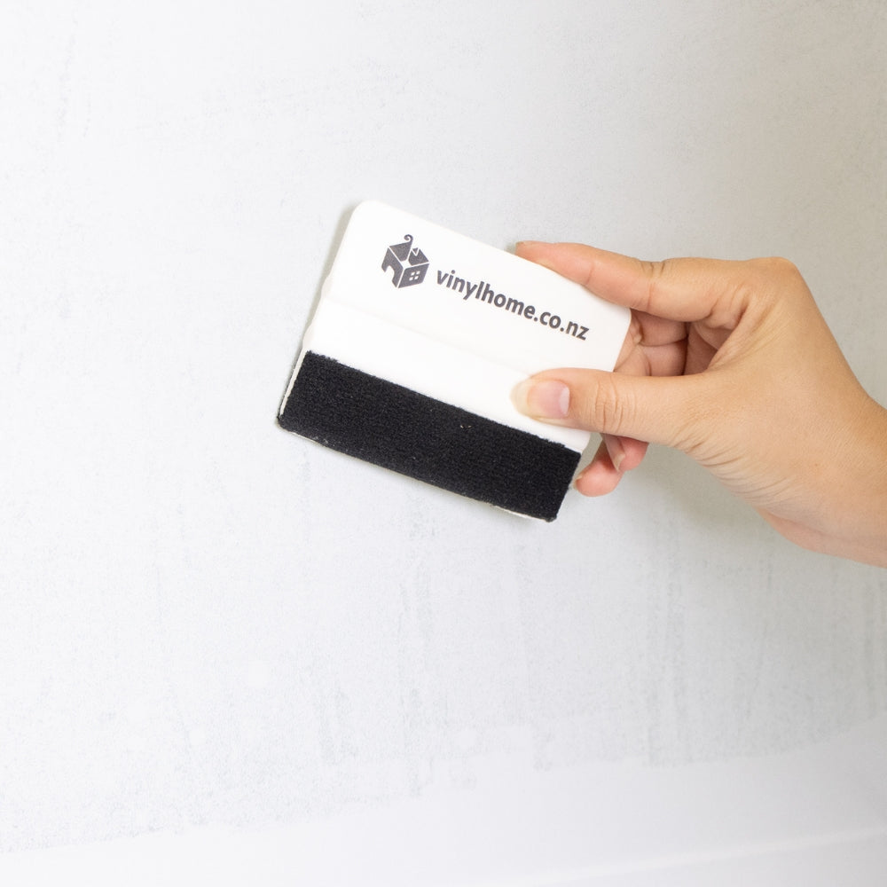 White frost window film applied with Vinyl Home squeegee