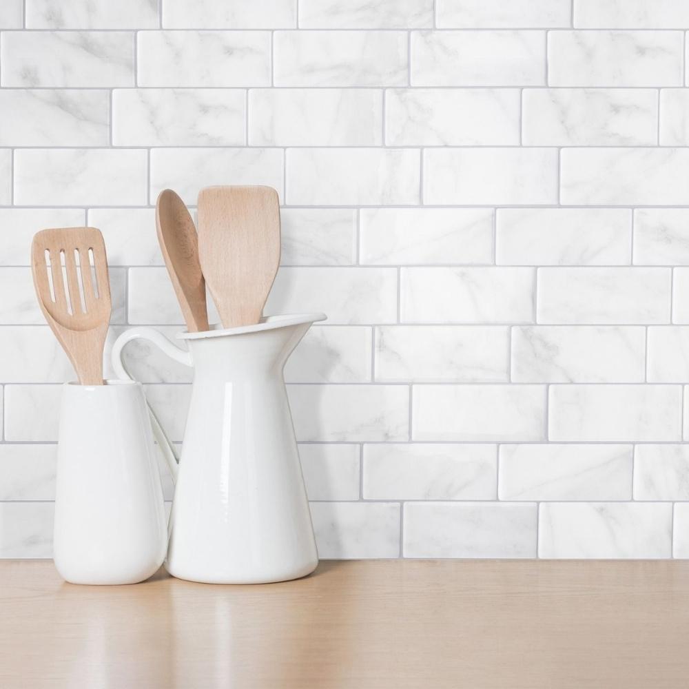 White and grey marble subway tiles as a splash back