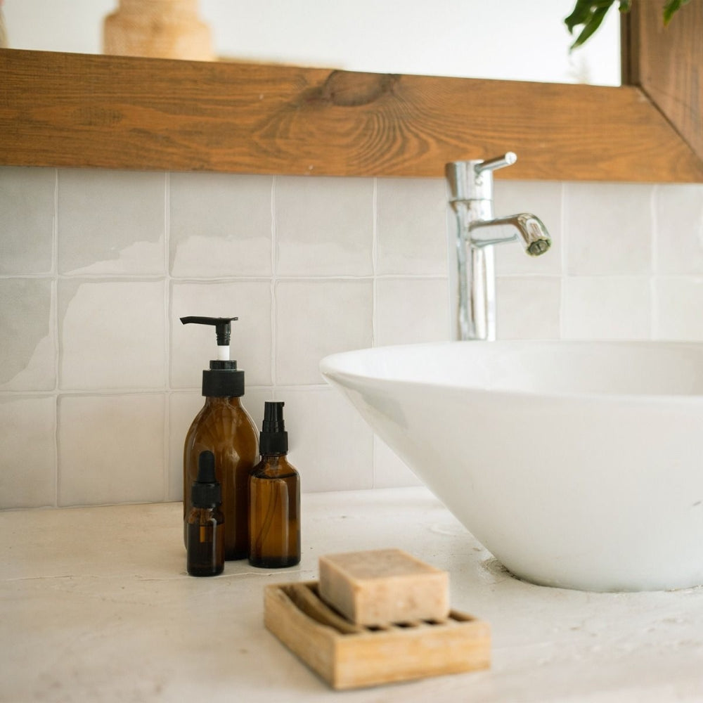 Creme square self-adhesive wall tile in bathroom