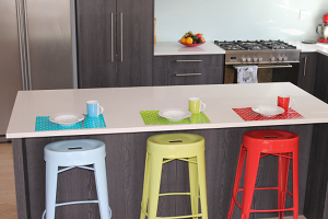 breakfast bar with a blue, green and red bar stool and placemats