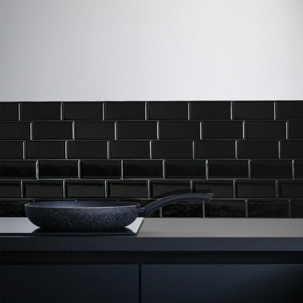 Black self-adhesive 3D subway tile in a kitchen