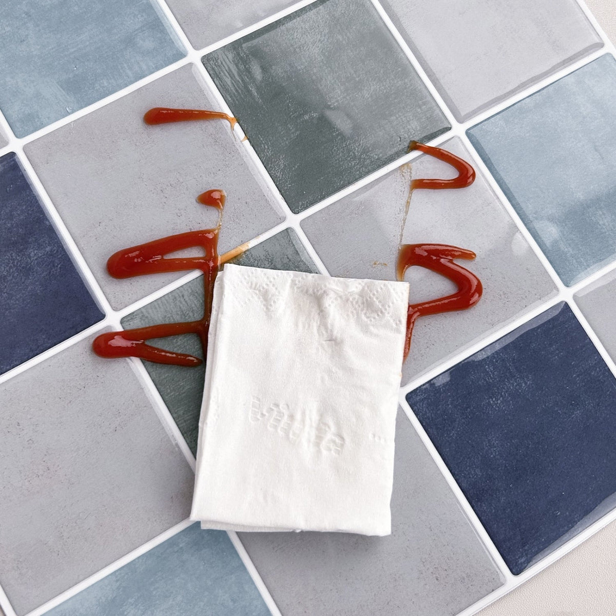 Blue, greige and green checkered tiles with white grout easy to clean