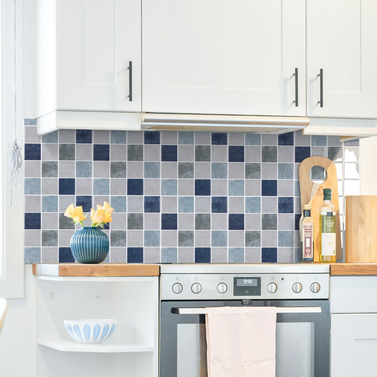 Blue, greige and green checkered tiles with white grout kitchen