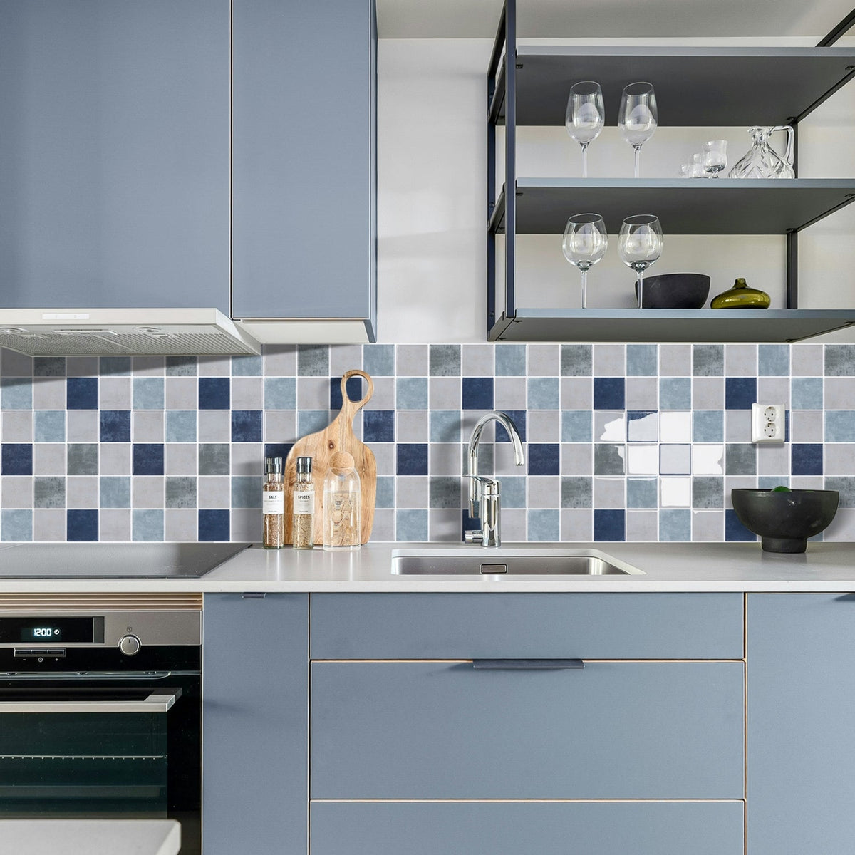 Blue, greige and green checkered tiles with white grout kitchen splashback