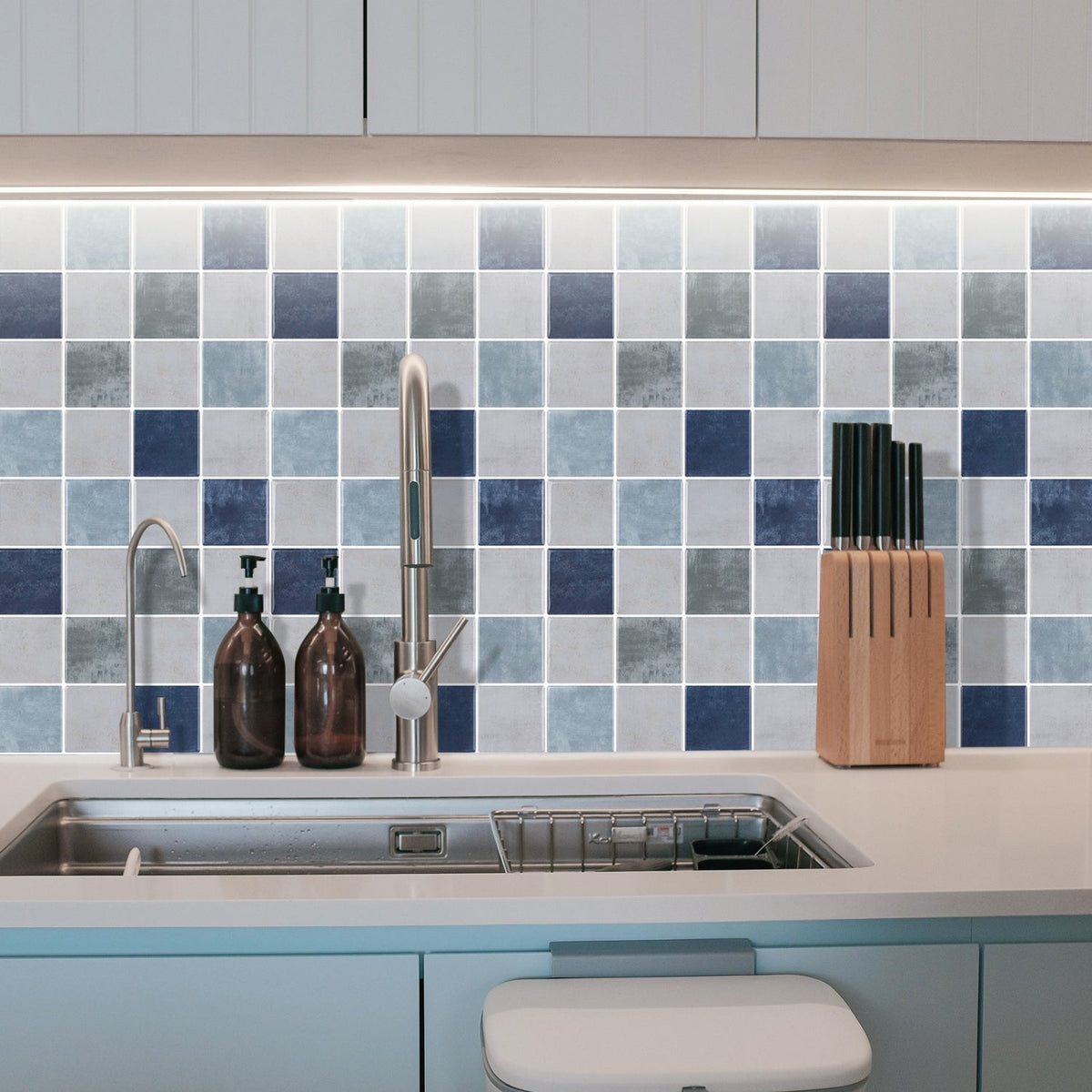 Blue, greige and green checkered tiles with white grout in kitchen