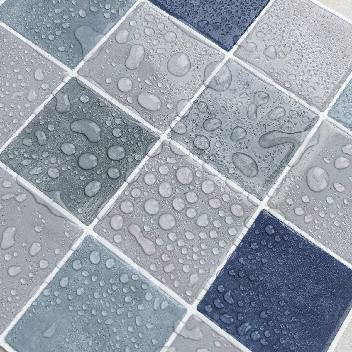 Blue, greige and green checkered tiles with white grout water resistant