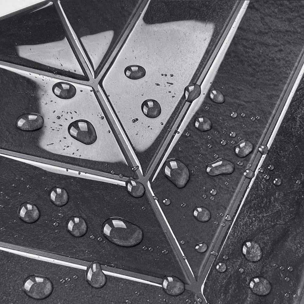 Close-up of a chevron tile with water droplets