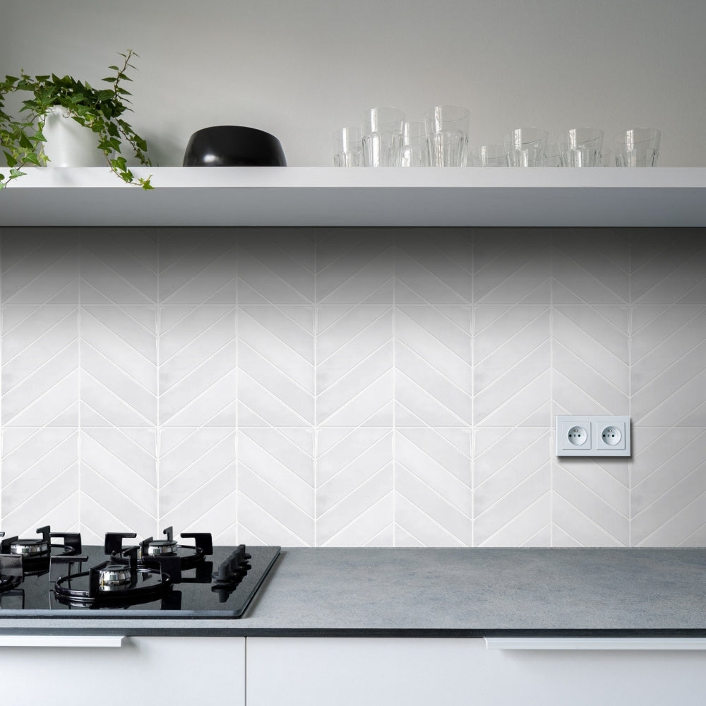 Modern kitchen with white tiled wall and grey countertop