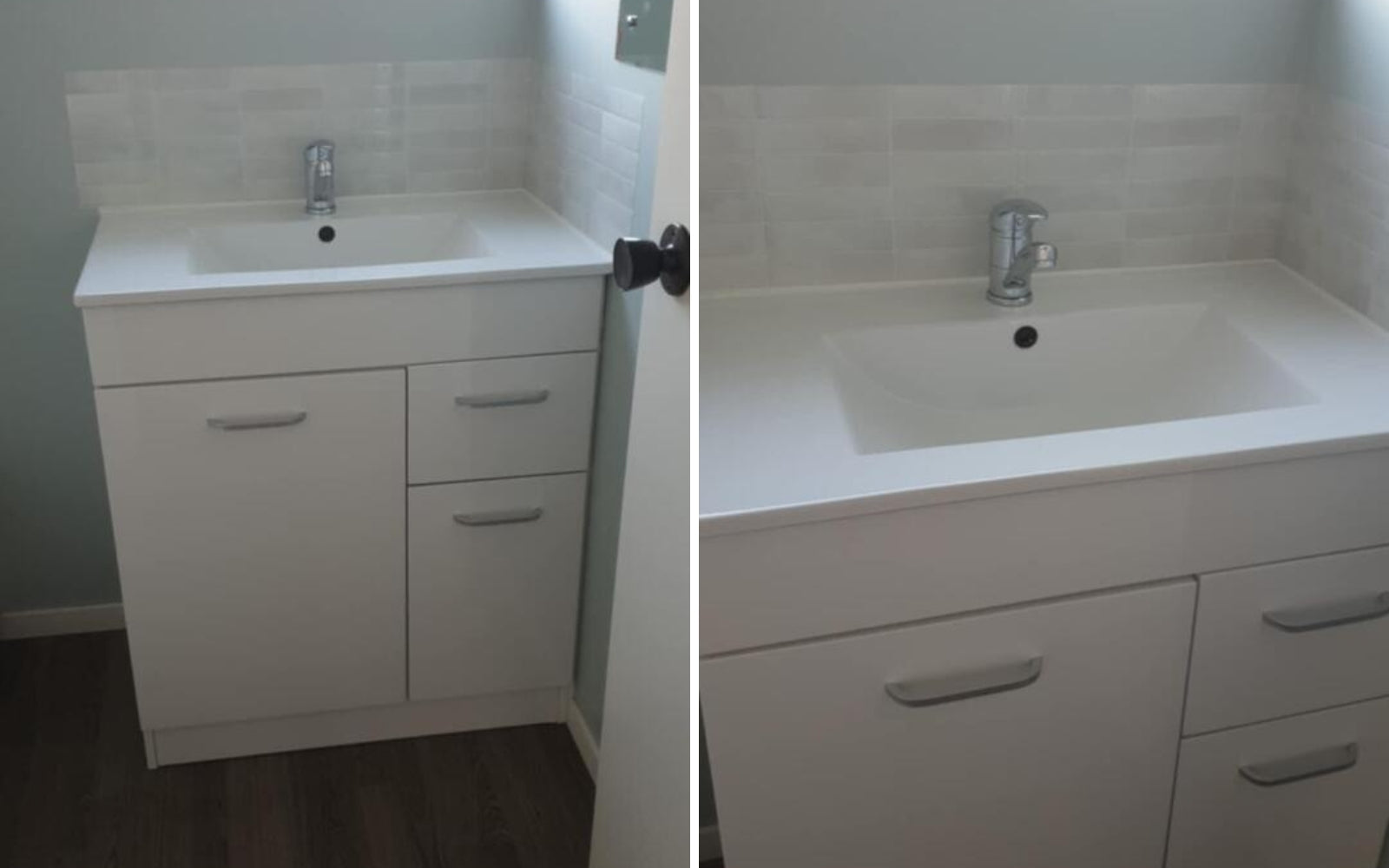 Bathroom vanity with sink and cabinets on a tiled wall.