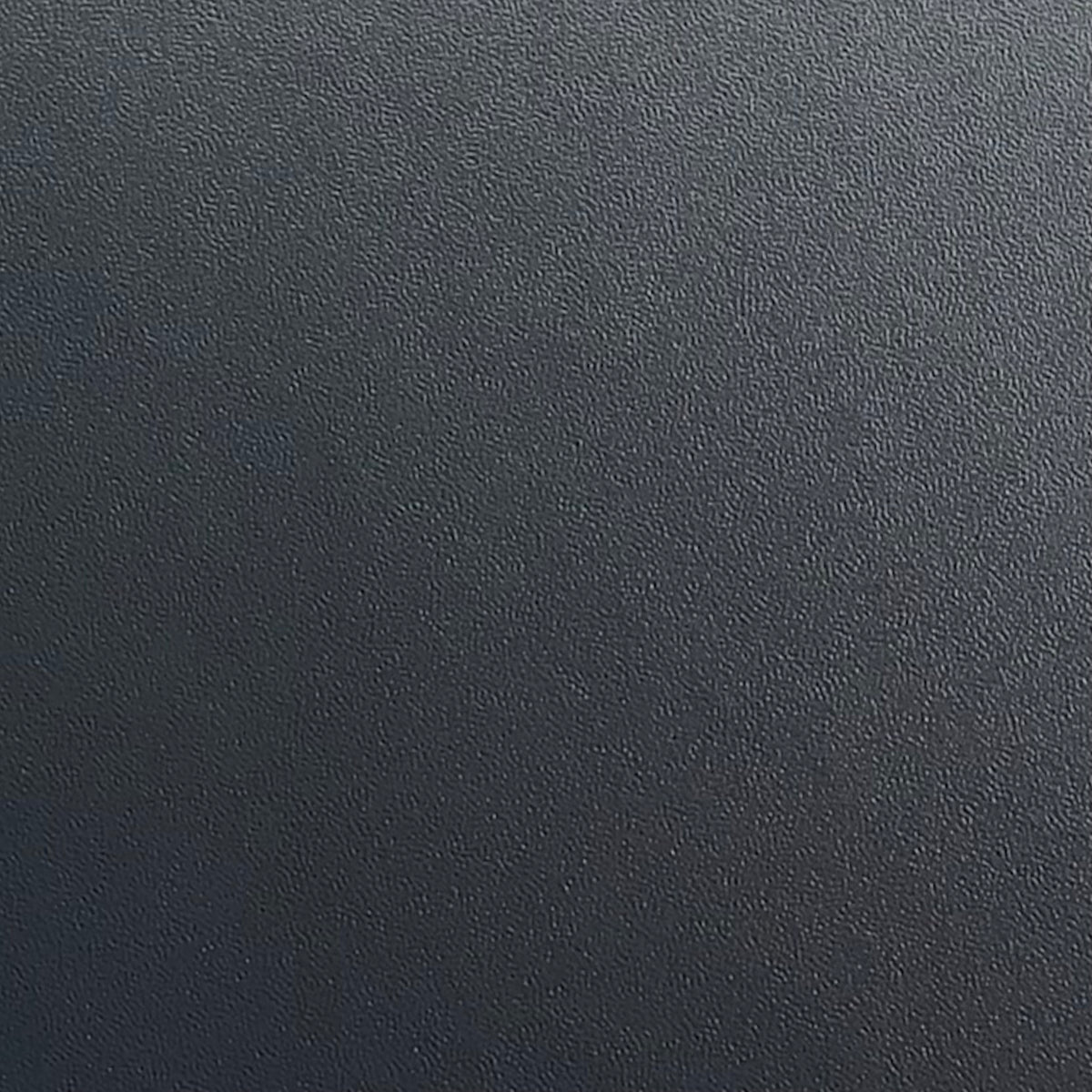 A close-up texture shot of a deep charcoal grey patterned adhesive vinyl.