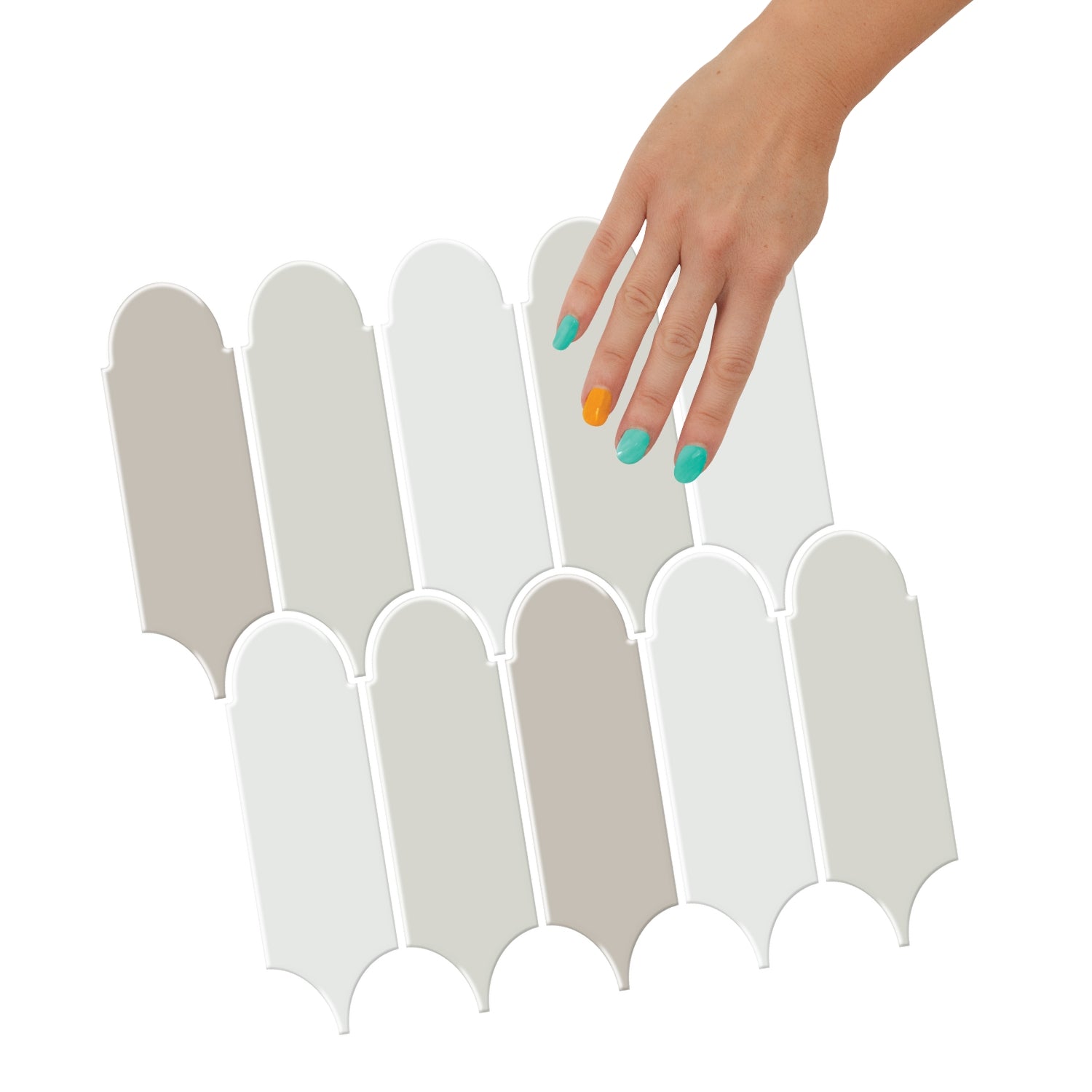 Grey feather tiles backsplash with a salt grinder and eggs on a countertop.