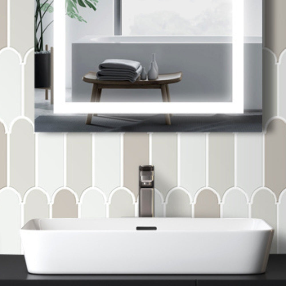 Bathroom setup with a white sink, mirror, and decorative elements.