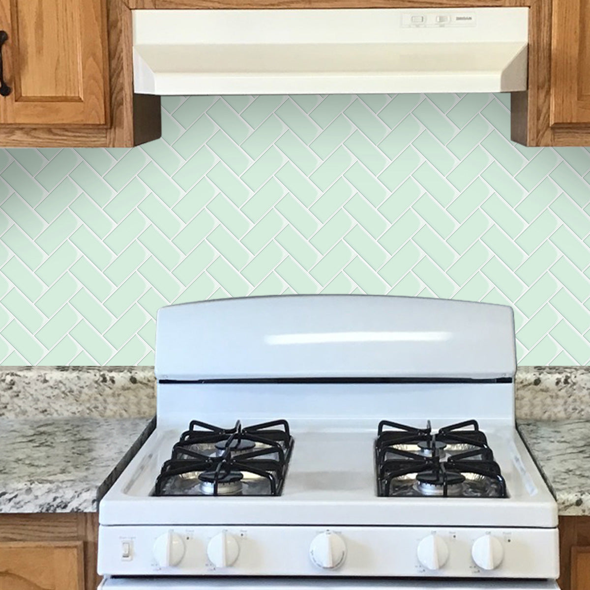 Mint green herringbone tile kitchen splash back
