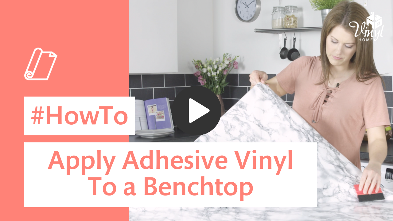Woman applying adhesive vinyl to a benchtop with text overlay 'How To Apply Adhesive Vinyl To a Benchtop'.