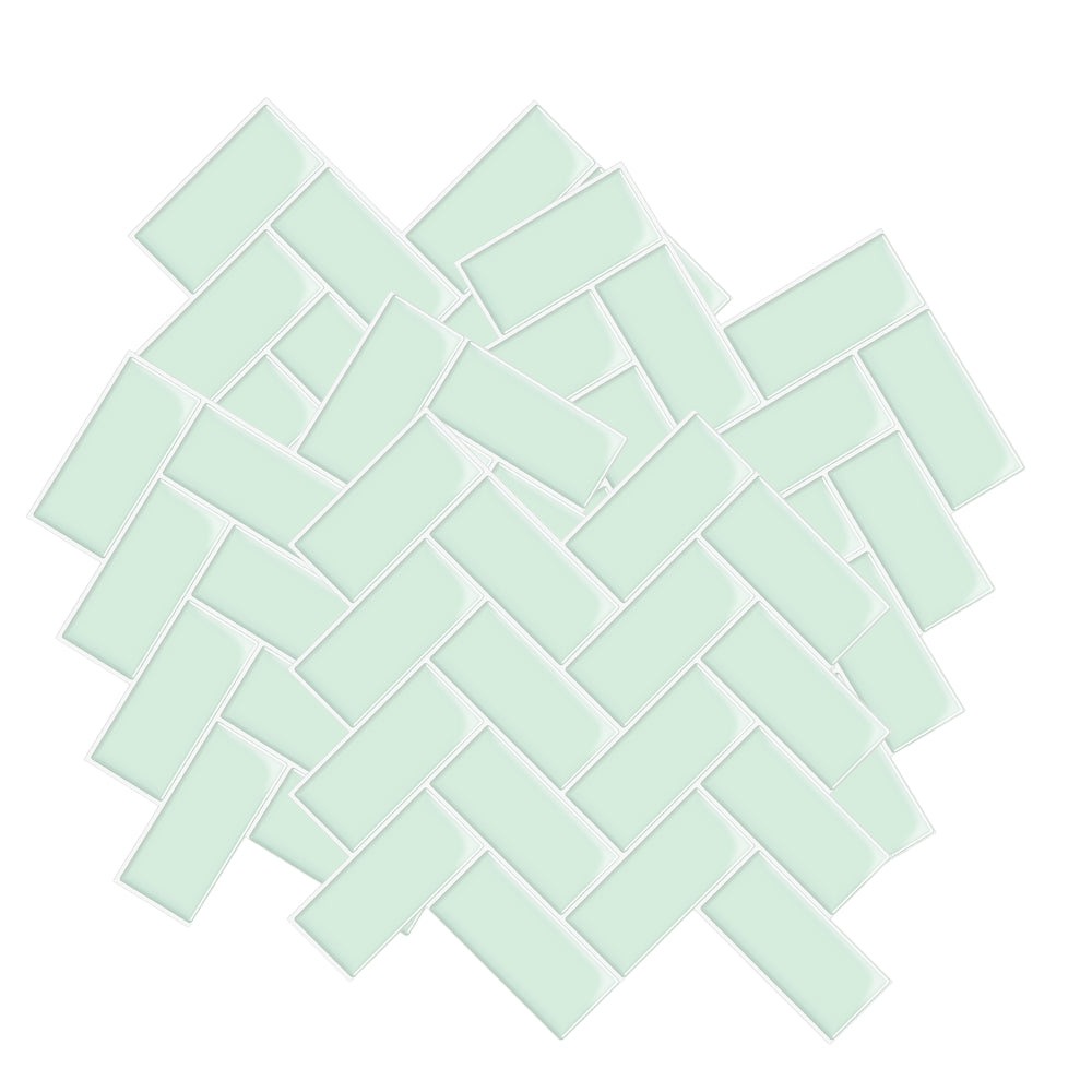 Mint green mosaic tiles arranged in a herringbone pattern on a white background