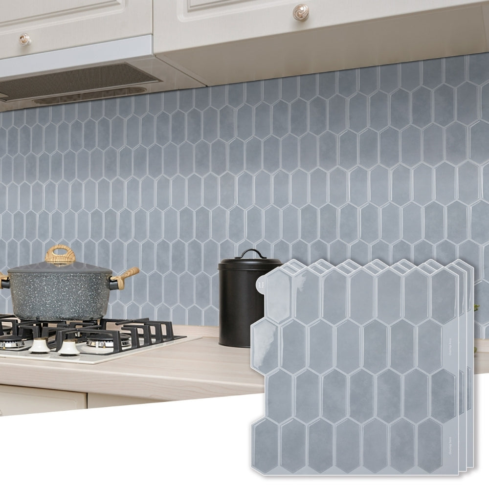 Kitchen backsplash with geometric pattern next to a stove and countertop.
