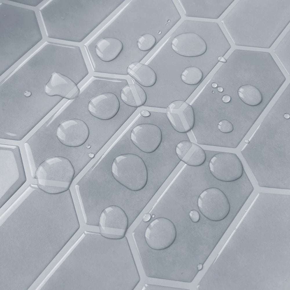 Hexagonal tile pattern with water droplets on a gray background