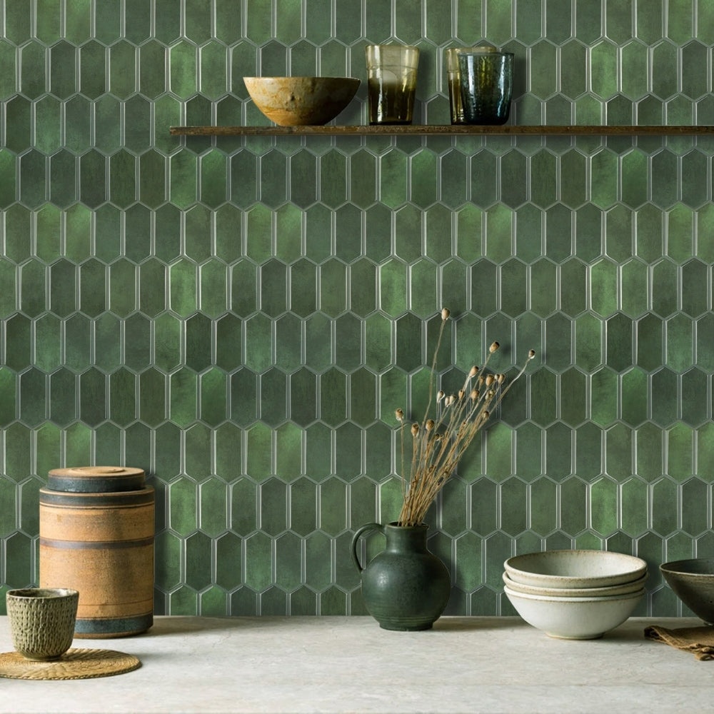 Green hexagonal tiles on a wall with decorative items below