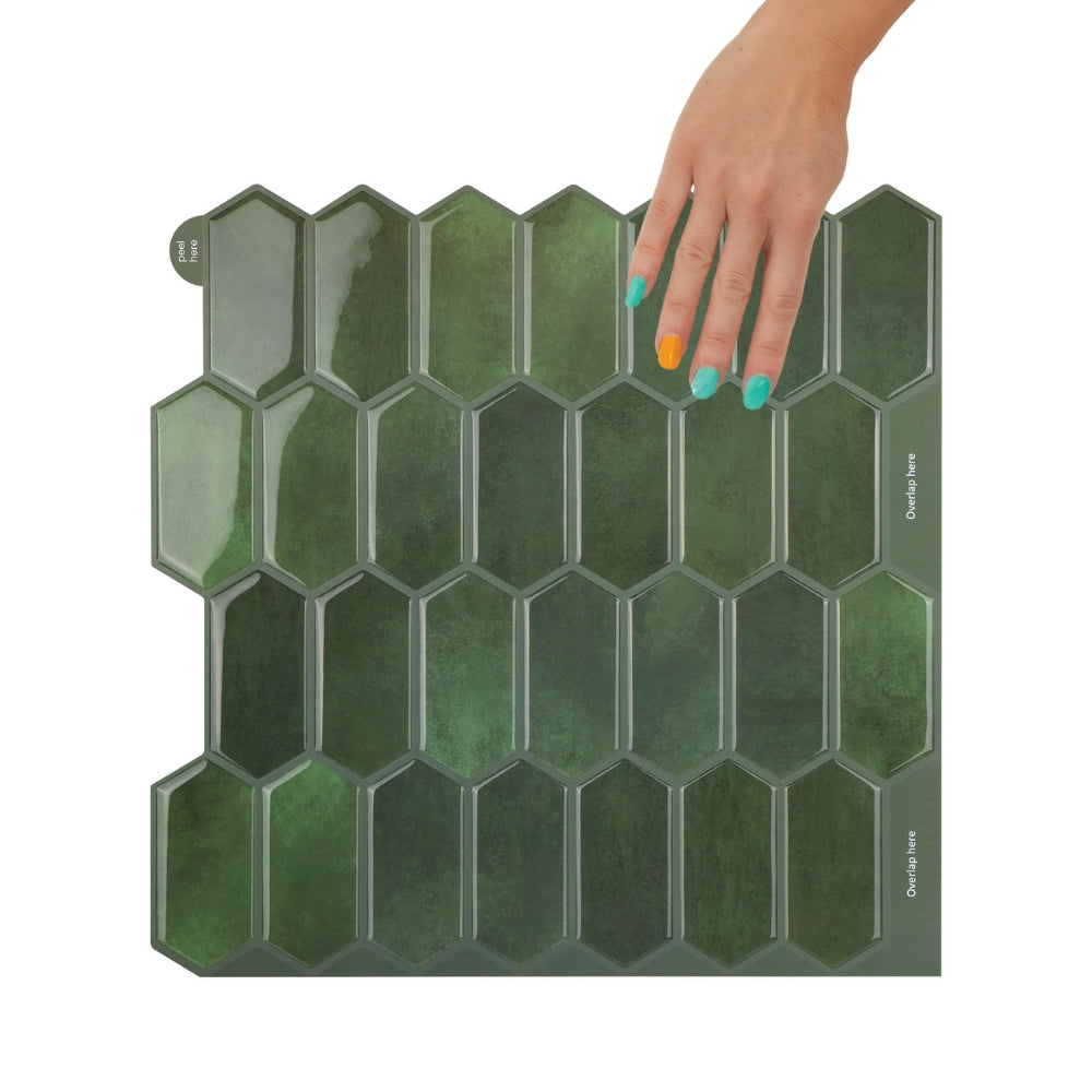 Hexagonal green tile with a hand touching it on a white background