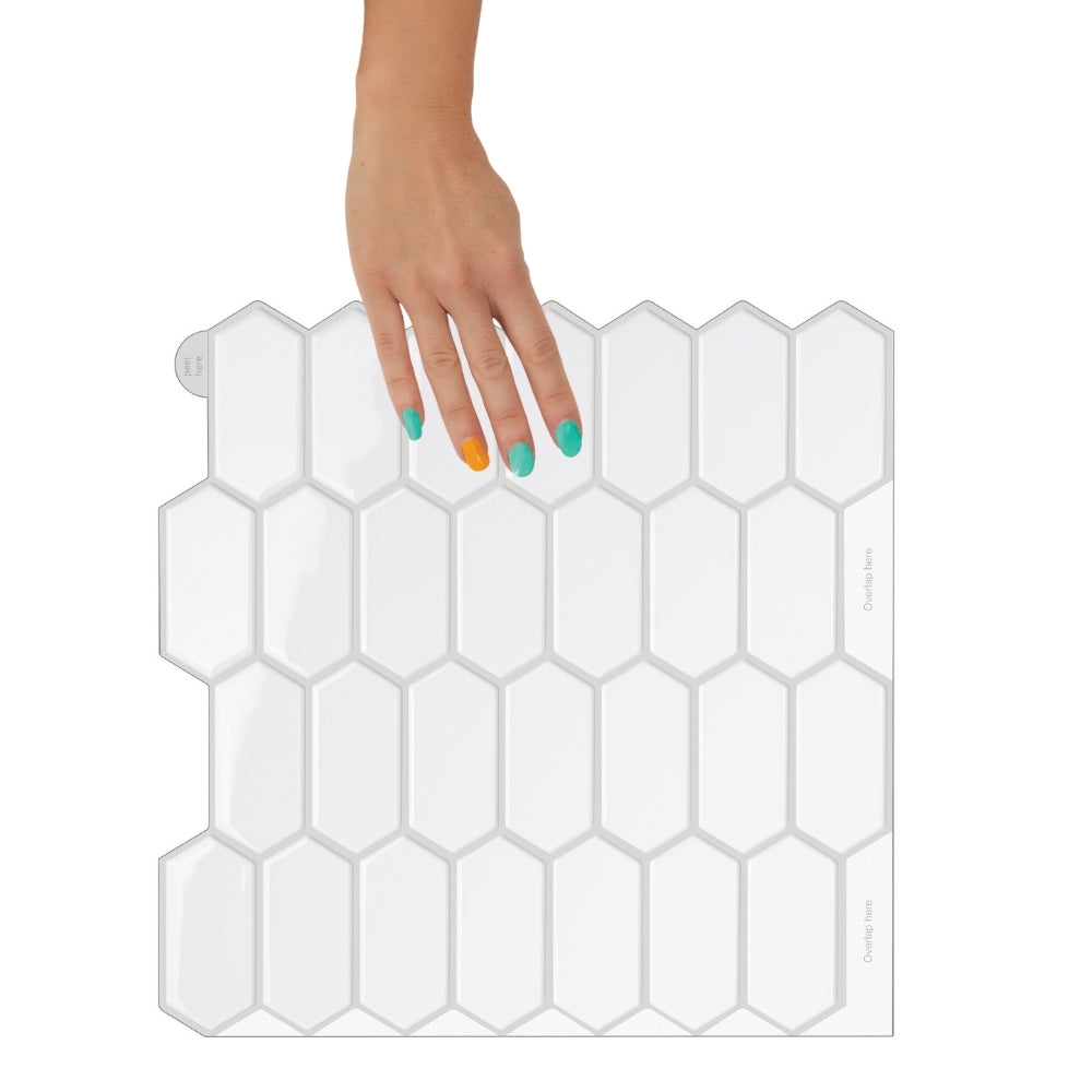 Hexagonal tile pattern with a hand holding one of the tiles on a white background