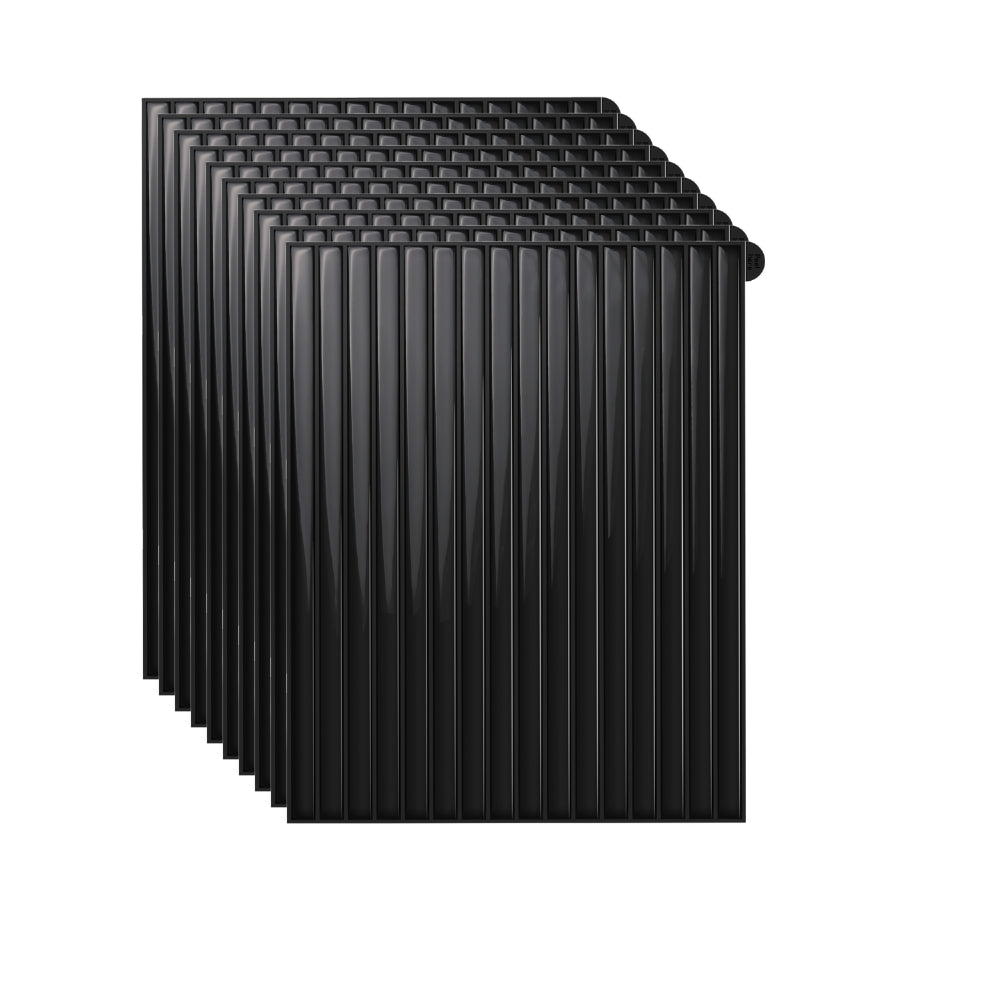 Stack of black reeded tiles on a white background