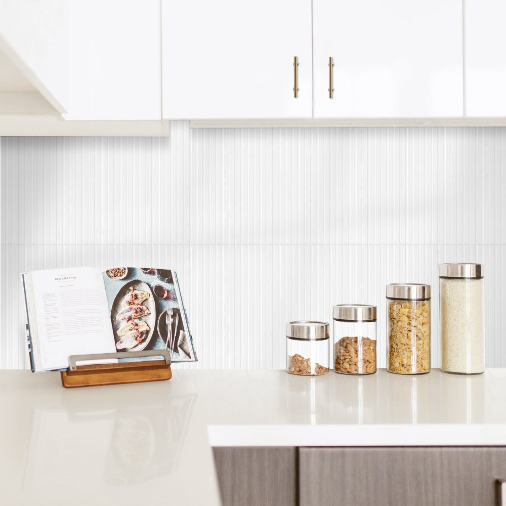 Modern kitchen counter with glass jars and a cookbook