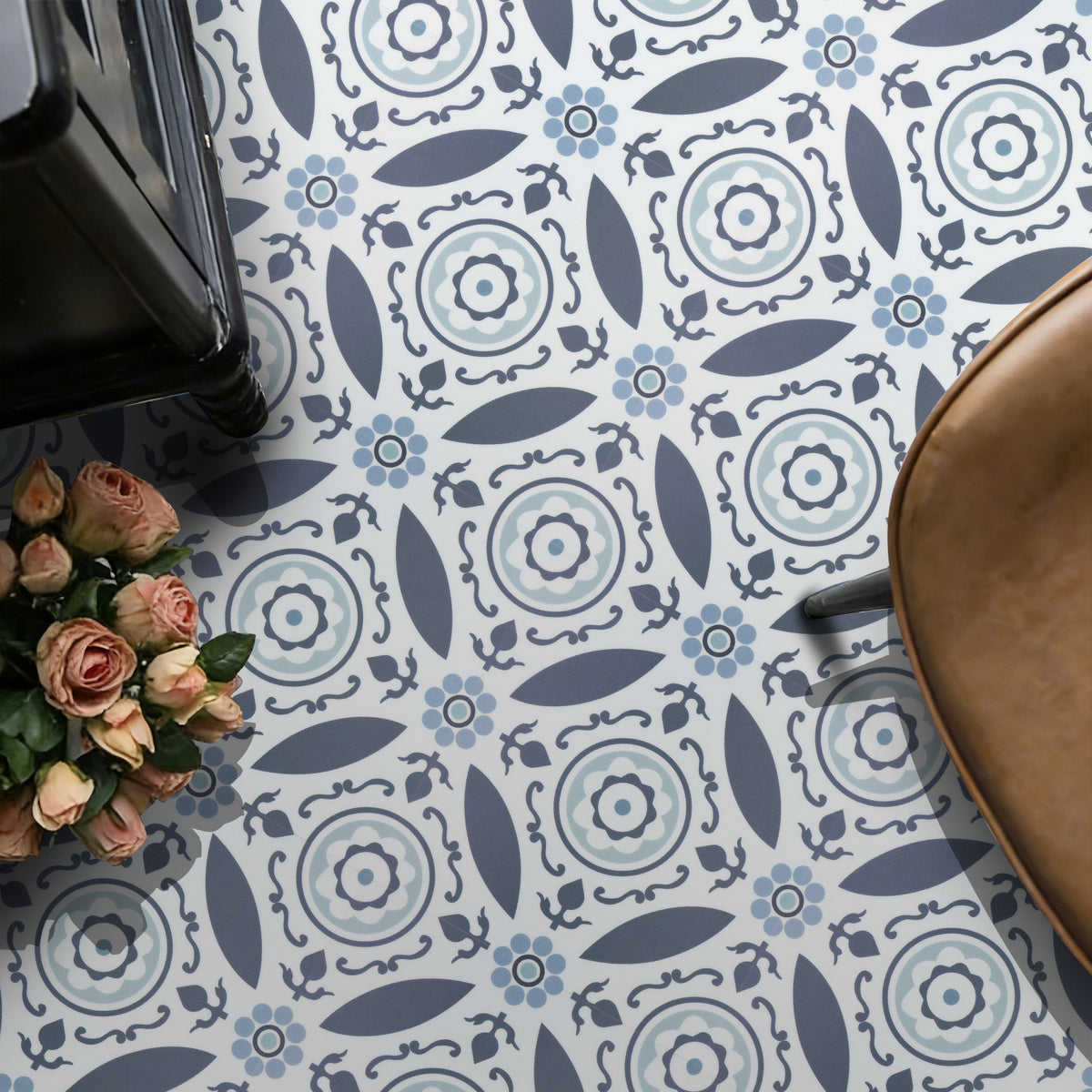 Decorative floor with a geometric pattern, flowers, and a chair.
