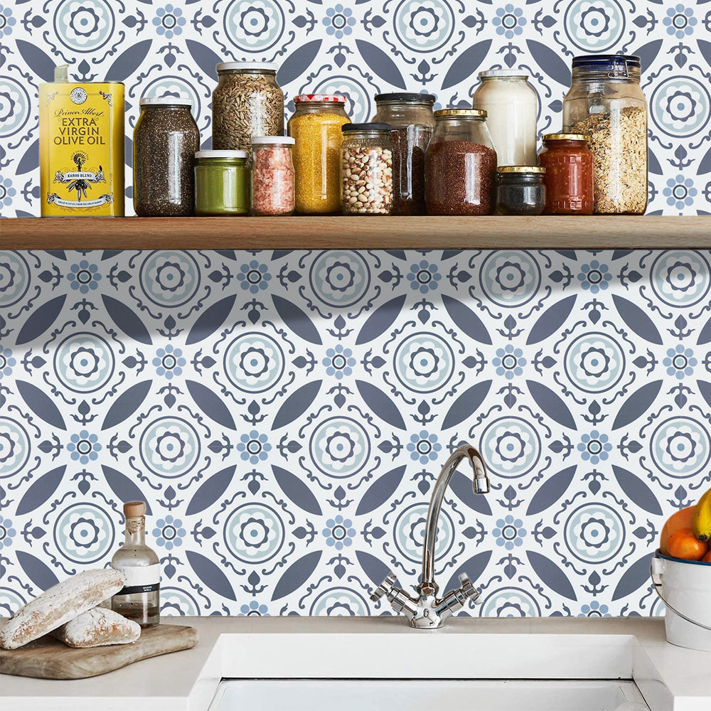 Kitchen counter with jars and a decorative blue tiled backsplash