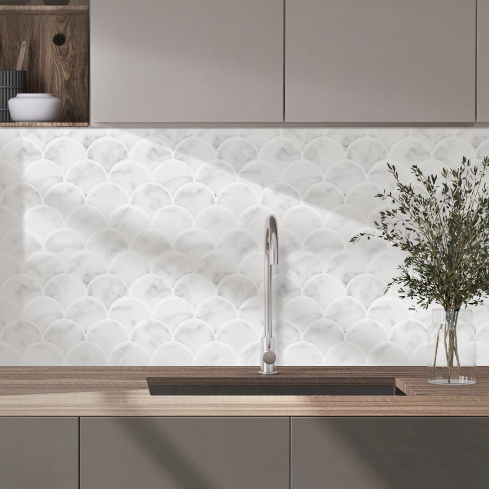 Modern kitchen with white textured backsplash, wooden countertop, and decorative vase.