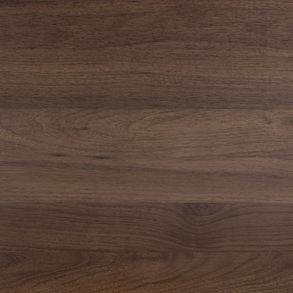 Close-up of a dark brown wooden surface with visible grain.
