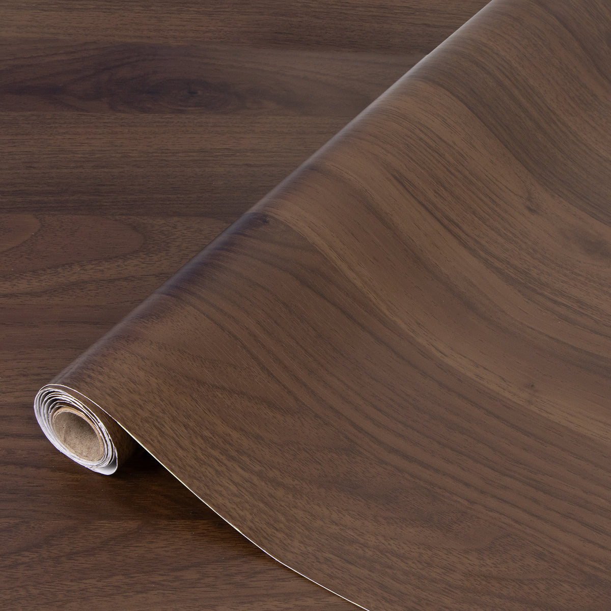 Roll of wood-patterned adhesive vinyl