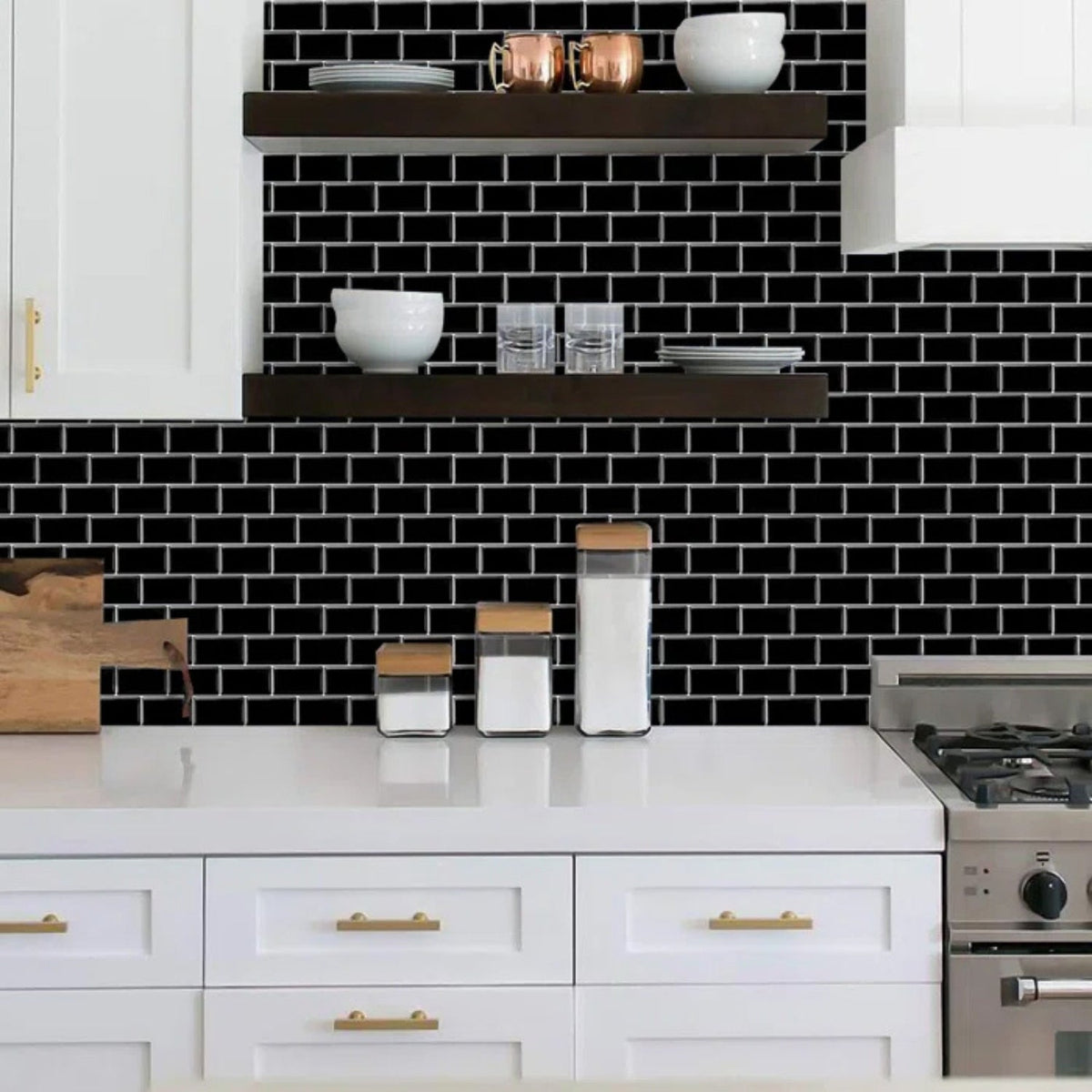 Black subway tiles with white grout as a kitchen splashback