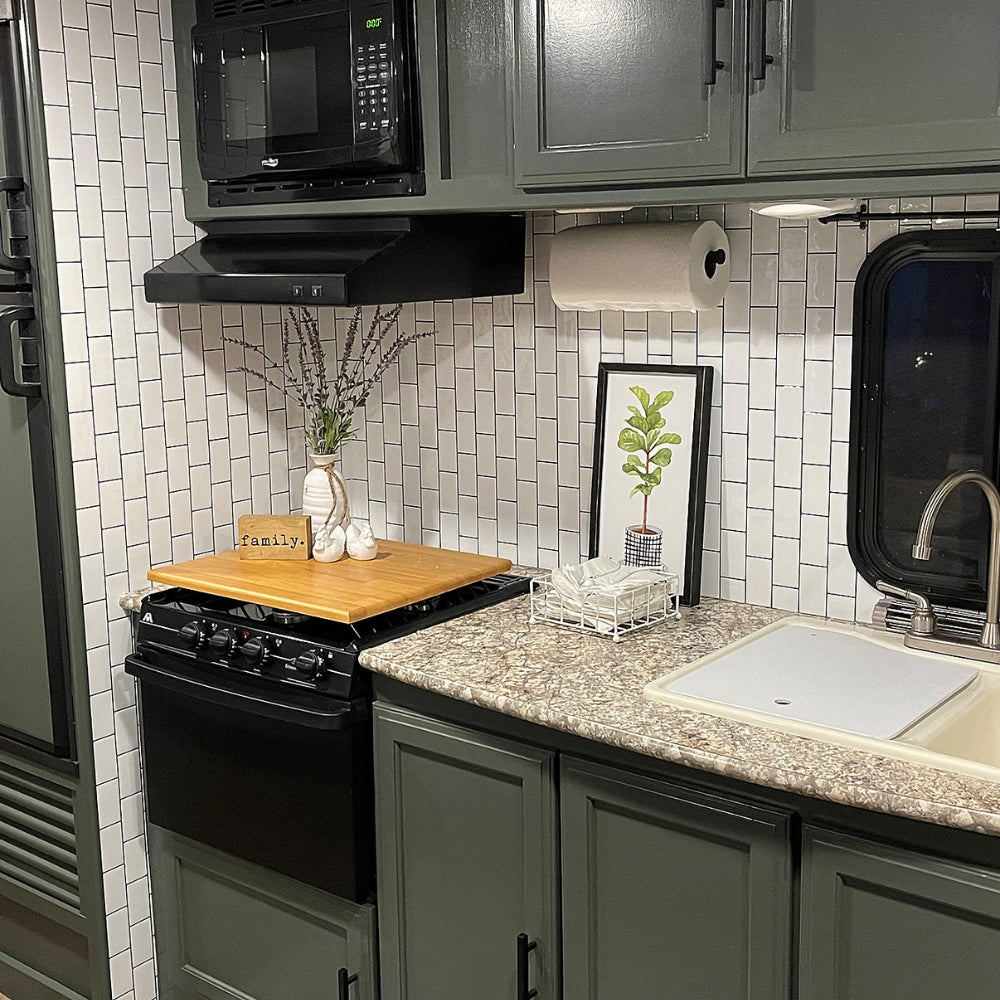 subway classic white tiles with grey grout installed upright in a camper