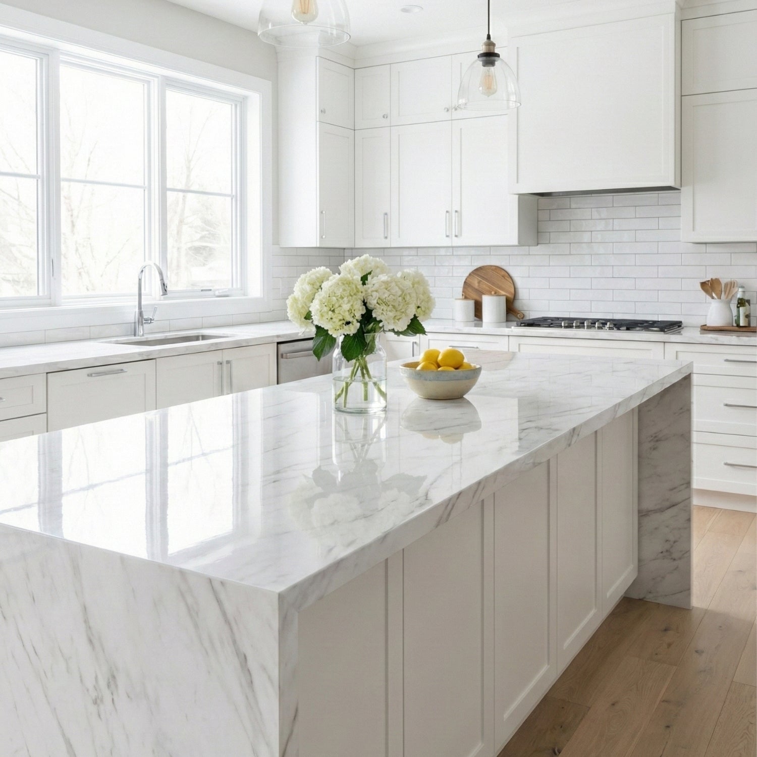 Modern kitchen with marble island and white cabinets