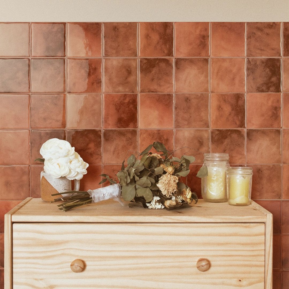 Square terracotta tiles on a wall