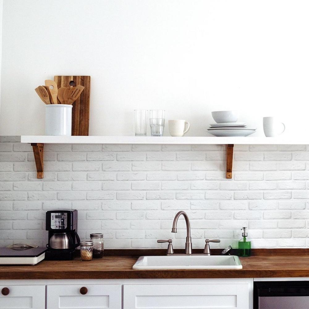 White and grey brick stick on tiles in kitchen