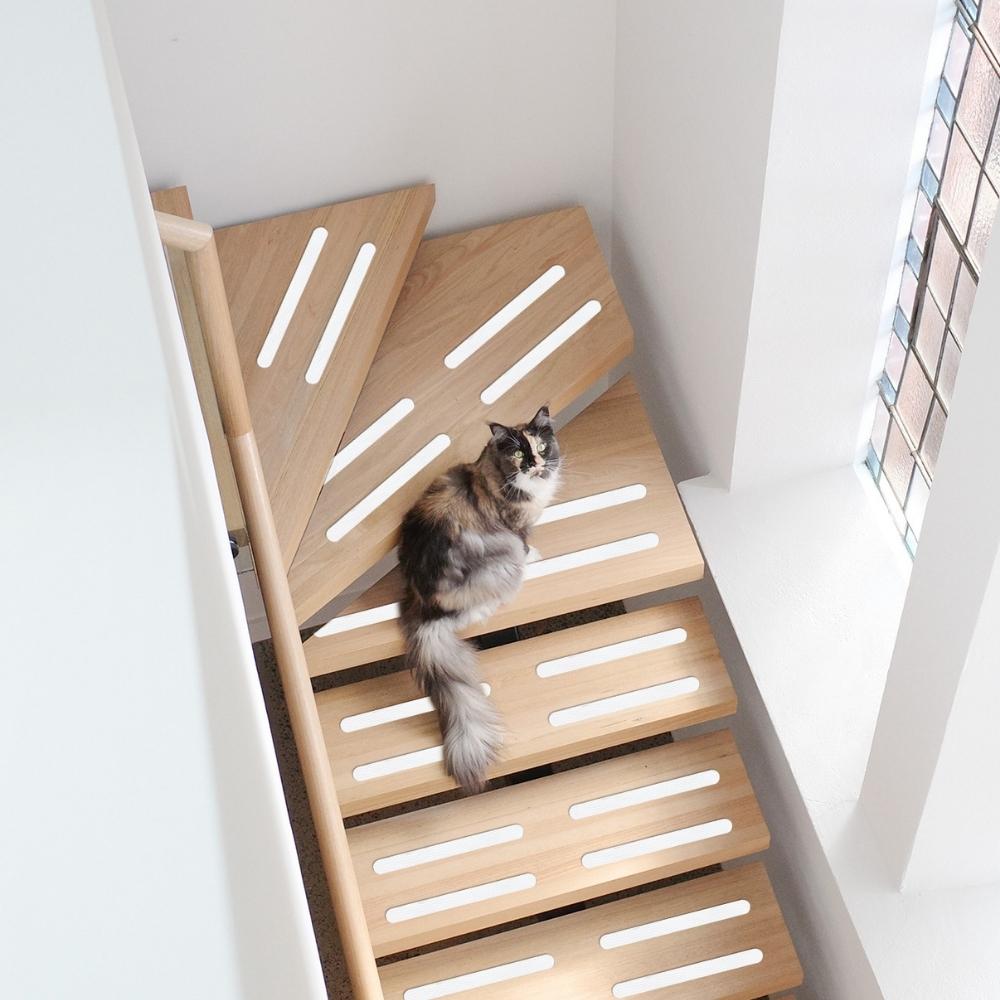 White anti-slip grip strips in stairs to prevent slipping