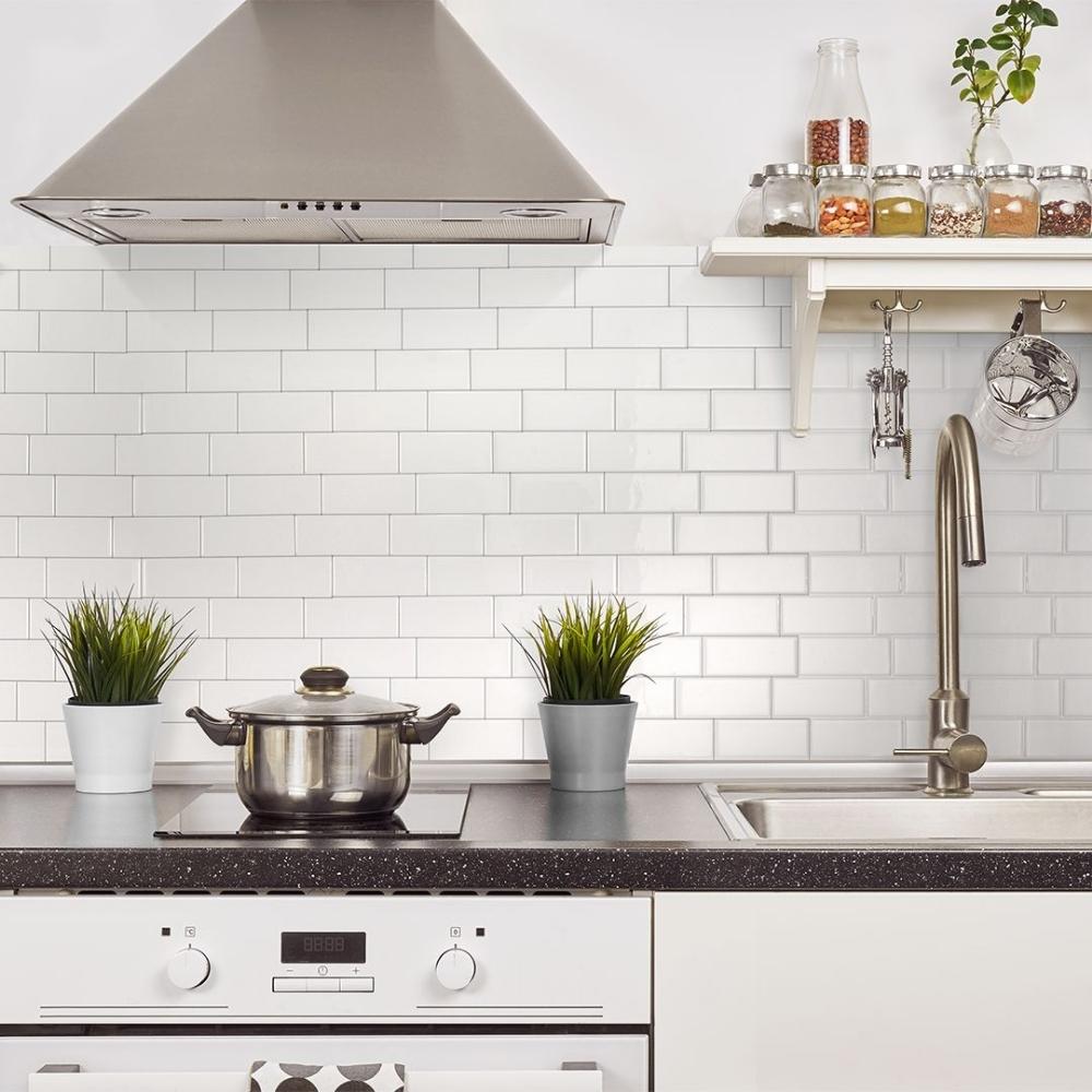 White self-adhesive 3D subway tiles with grey grout in kitchen