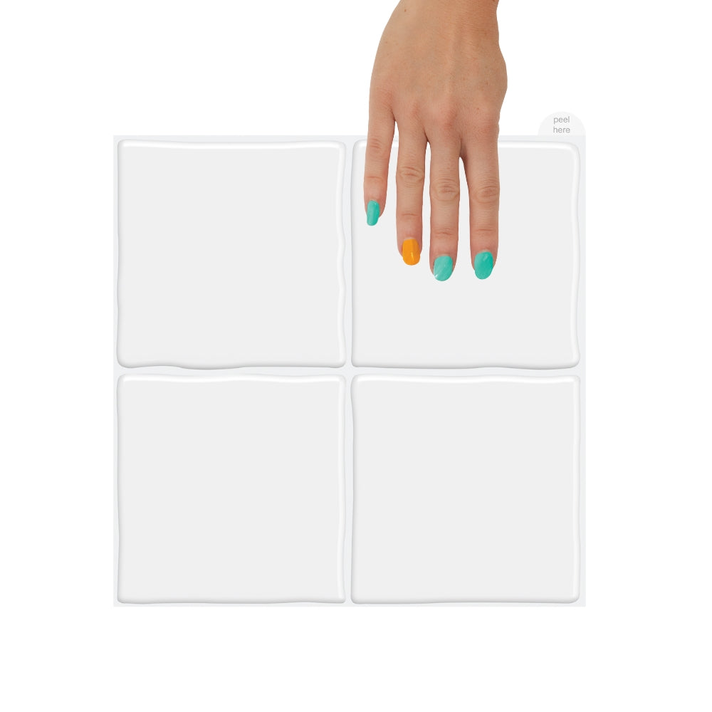 White square zellige wall tiles hold in a hand